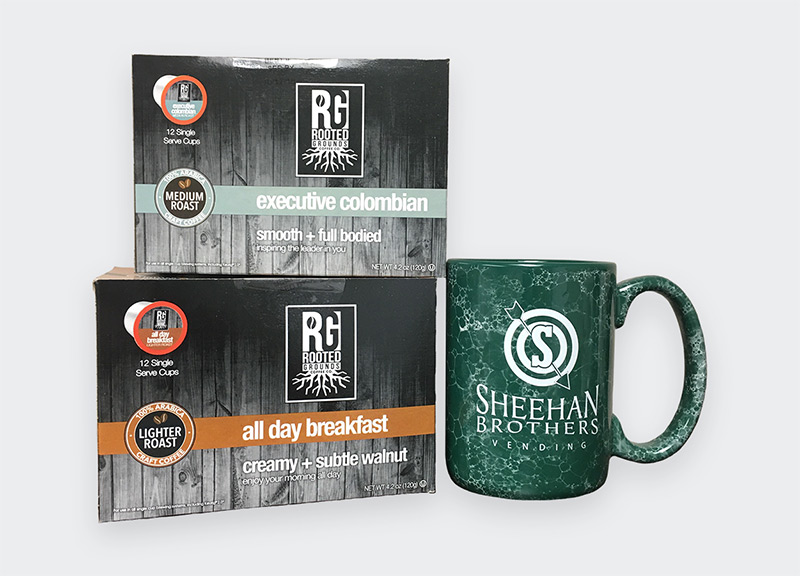Sheehan Brothers mug next to roasted coffee in the original packaging